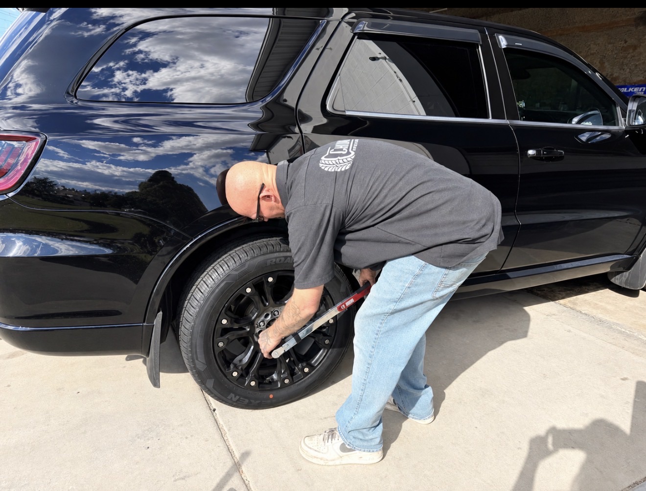 A Choice Tires technician torquing the lug nuts on a freshly mounted tire in Grantsville
