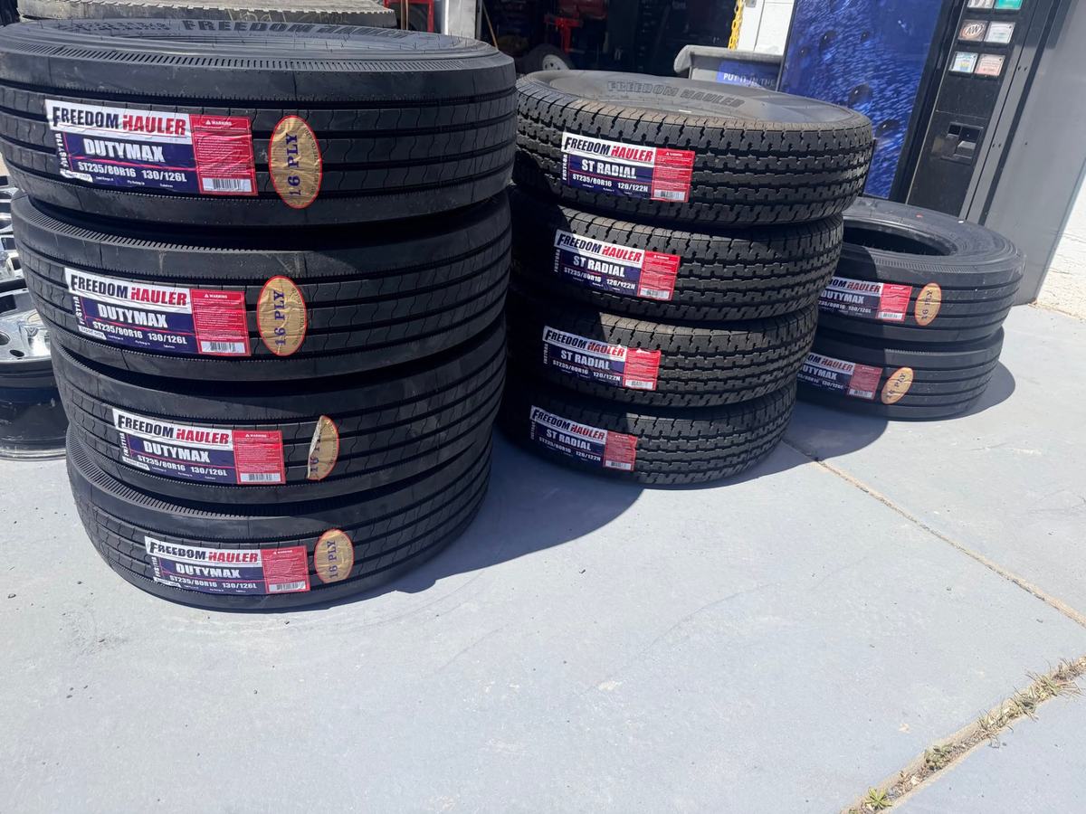 Stacks of 16-ply commercial trailer tires in stock at Choice Tires in Grantsville