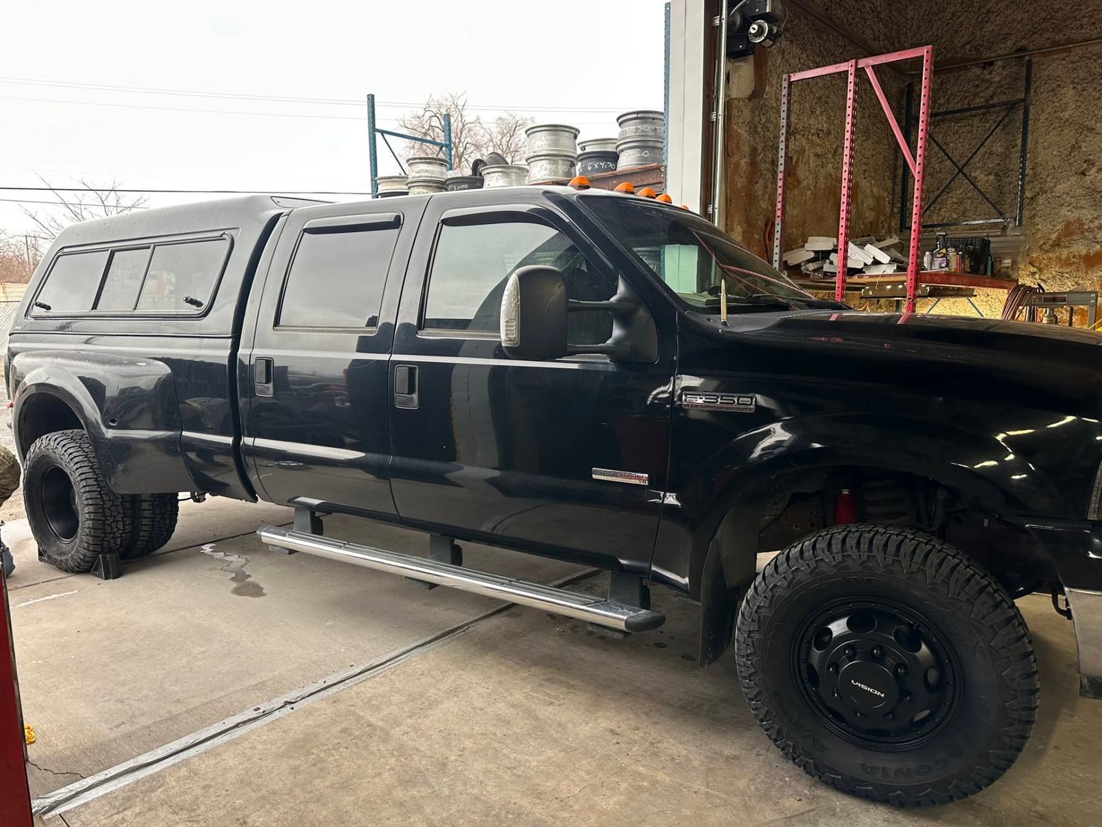 A dual-rear-wheel Ford F-350 in the Choice Tires service bay in Grantsville, Utah